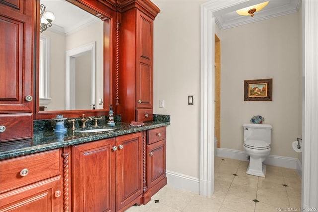 bathroom with tile floors, ornamental molding, toilet, and vanity