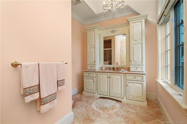 bathroom with crown molding, tile flooring, a notable chandelier, and vanity