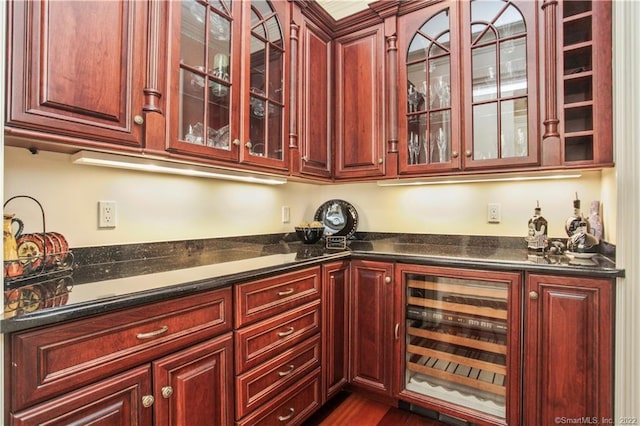 kitchen featuring wine cooler and dark hardwood / wood-style flooring