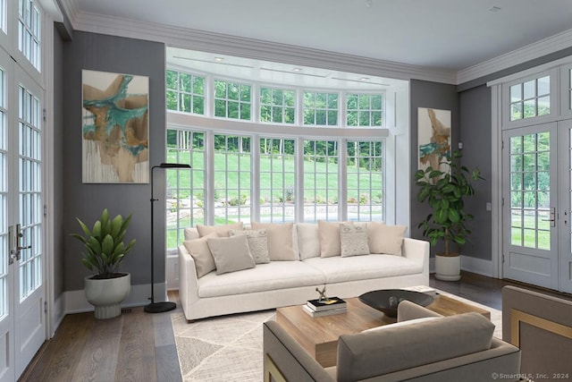 living room featuring crown molding, wood finished floors, french doors, and baseboards