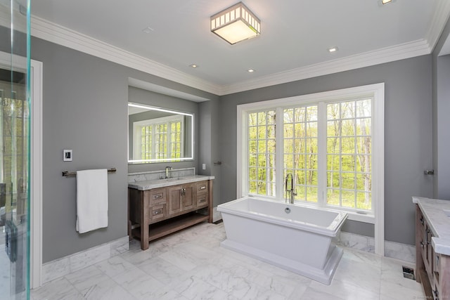 bathroom with baseboards, plenty of natural light, marble finish floor, and vanity