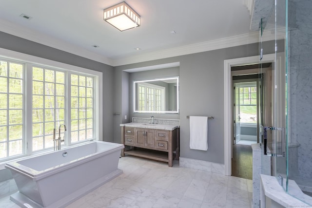 full bath with marble finish floor, a wealth of natural light, and ornamental molding