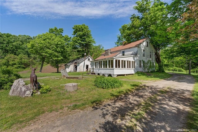 exterior space with a front lawn