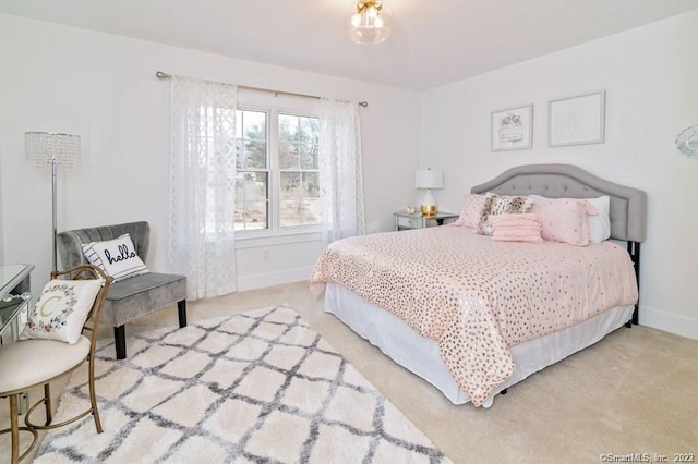 bedroom with light colored carpet