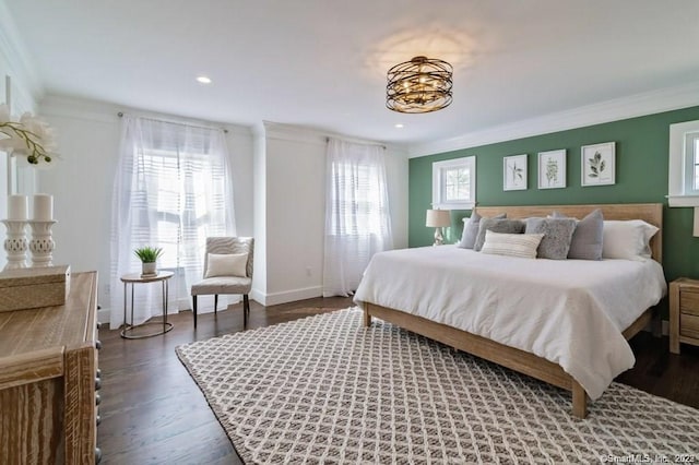 bedroom featuring dark hardwood / wood-style flooring and ornamental molding