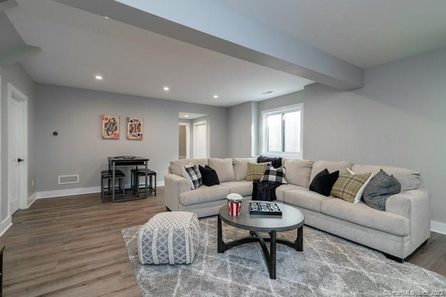 living room with dark hardwood / wood-style floors