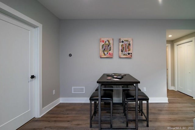 dining room featuring dark wood-type flooring