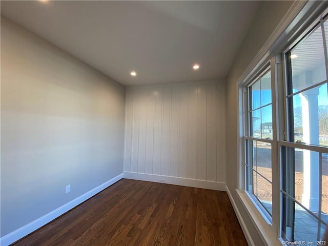 unfurnished room featuring dark hardwood / wood-style floors