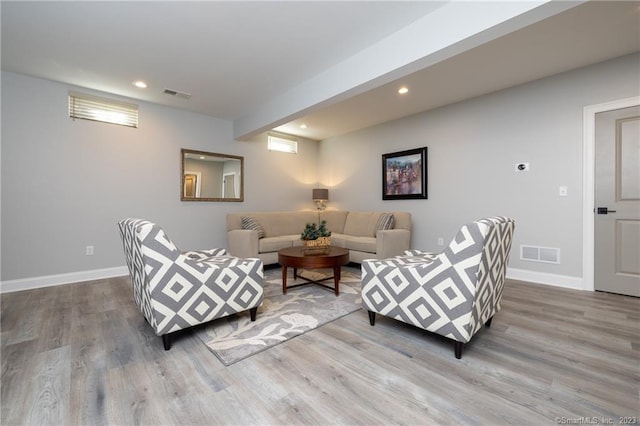 living room with light hardwood / wood-style floors