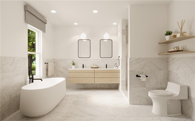 bathroom featuring vanity, tile floors, toilet, and tile walls