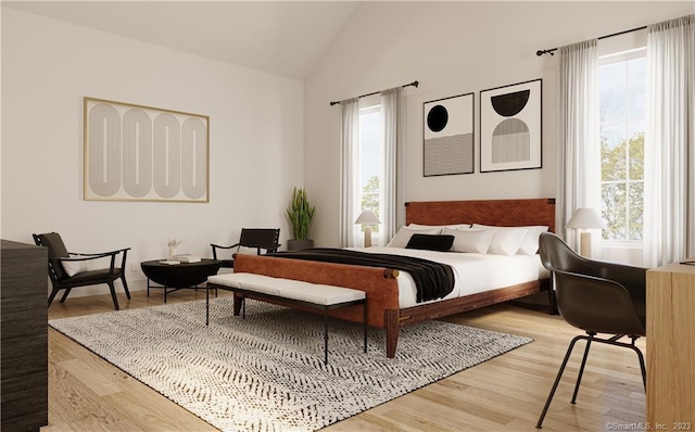 bedroom featuring lofted ceiling and light hardwood / wood-style floors