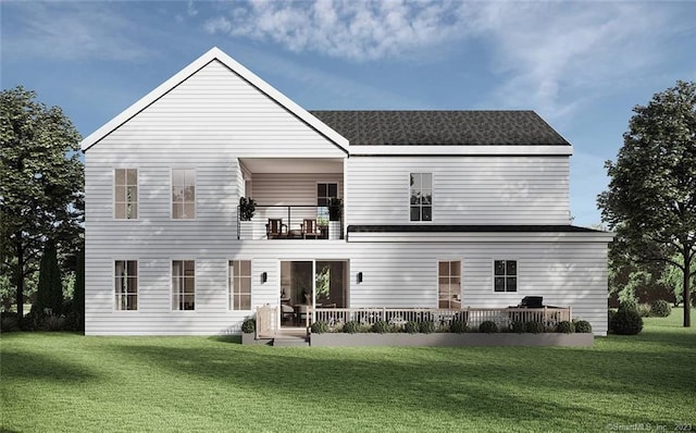 rear view of house featuring a balcony and a lawn