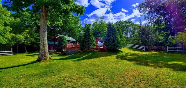 view of yard featuring a wooden deck