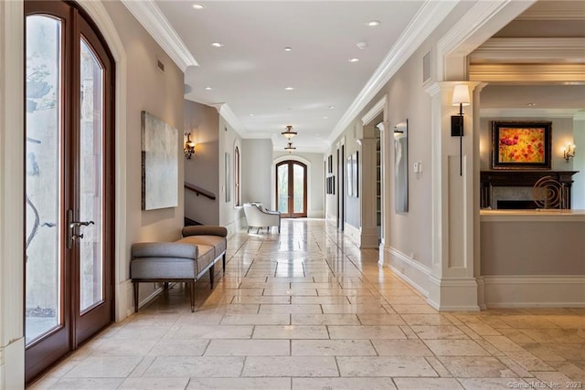 interior space featuring ornamental molding, light tile floors, and french doors