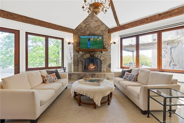 living room featuring plenty of natural light, lofted ceiling, and a fireplace