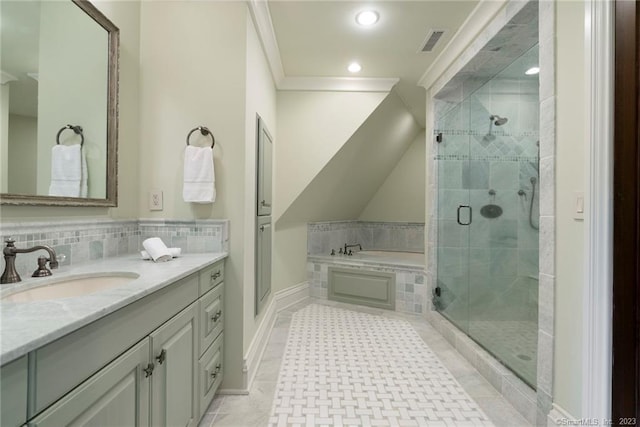 bathroom featuring tile flooring, plus walk in shower, ornamental molding, and vanity with extensive cabinet space