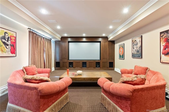 home theater featuring ornamental molding and dark carpet