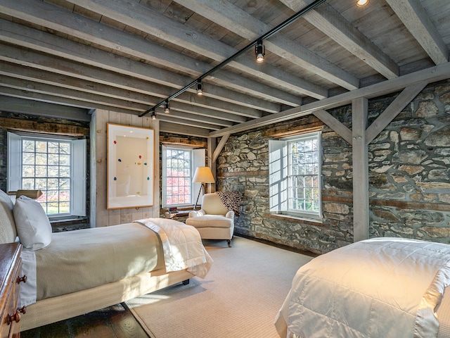 bedroom featuring multiple windows, beamed ceiling, and wooden ceiling