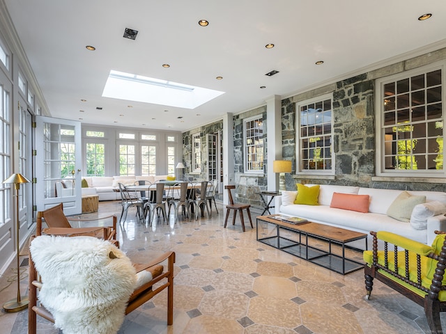 sunroom / solarium with a skylight