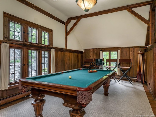 rec room with wood walls, beam ceiling, and high vaulted ceiling