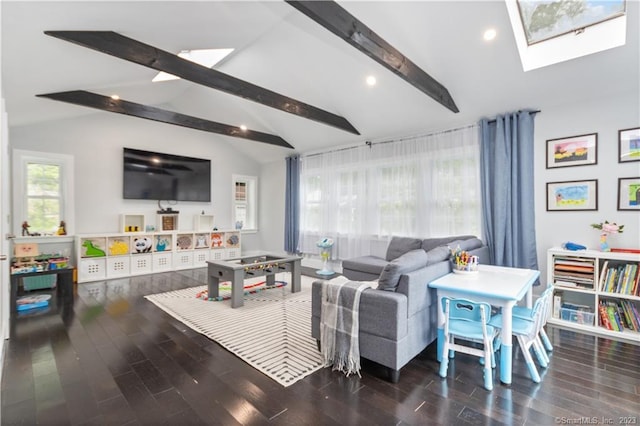 living room featuring vaulted ceiling with skylight and dark hardwood / wood-style flooring