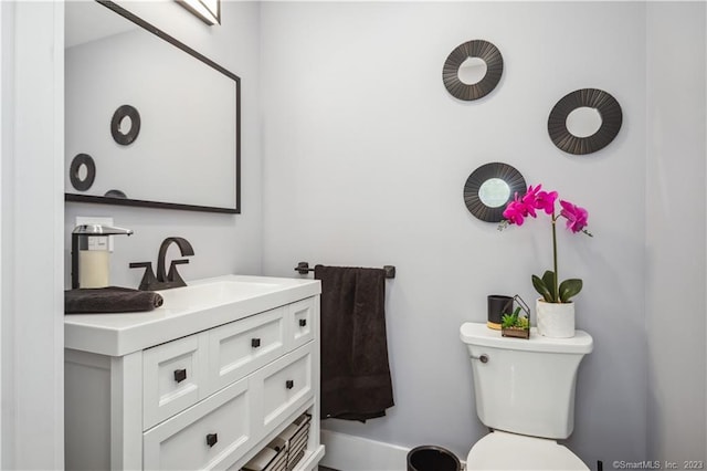 bathroom with toilet and vanity