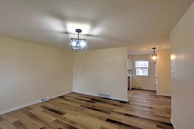 spare room featuring hardwood / wood-style flooring