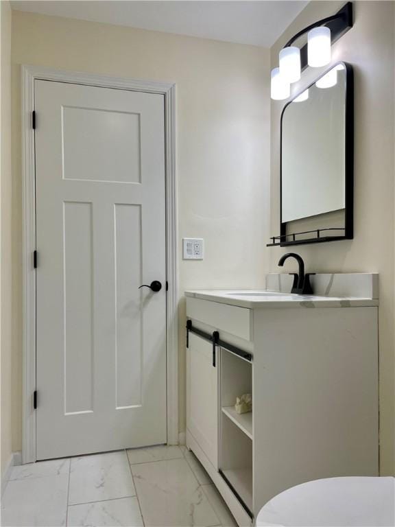 bathroom with vanity and toilet