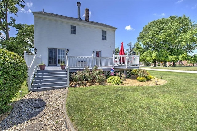 220 W Main St, Mt Zion, IL 62549 - back of property with a wooden deck and a lawn