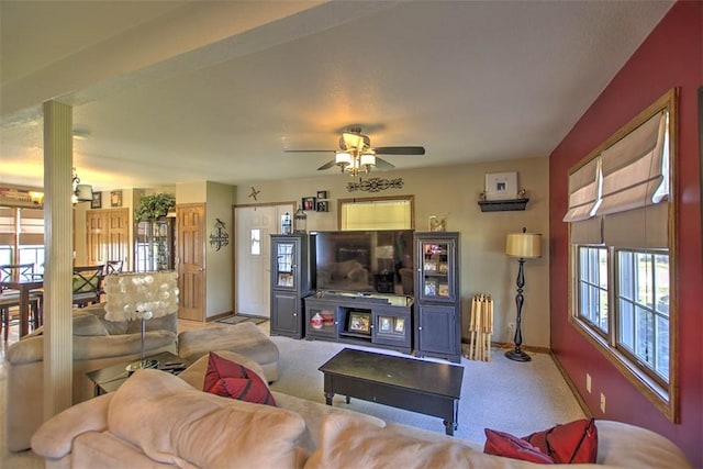 220 W Main St, Mt Zion, IL 62549 - carpeted living area with plenty of natural light and a ceiling fan