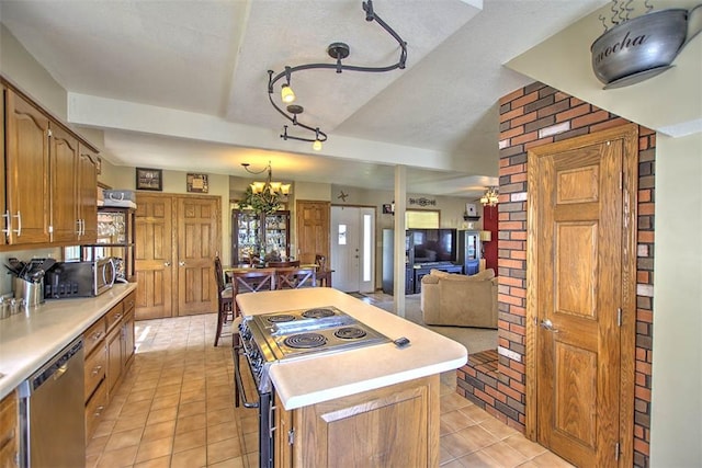 220 W Main St, Mt Zion, IL 62549 - kitchen featuring stainless steel appliances, a center island, light tile patterned floors, a chandelier, and light countertops