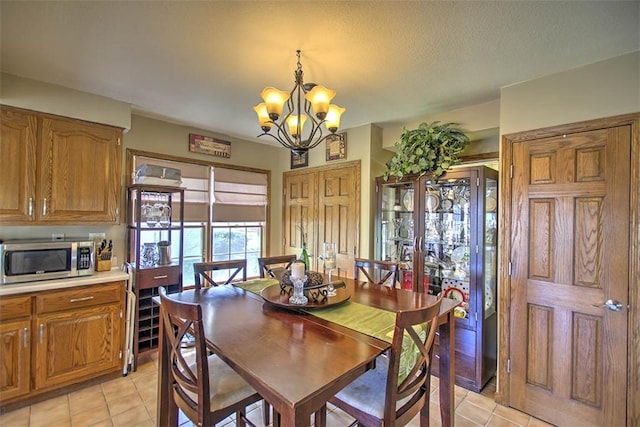 220 W Main St, Mt Zion, IL 62549 - dining area with light tile patterned floors and a chandelier