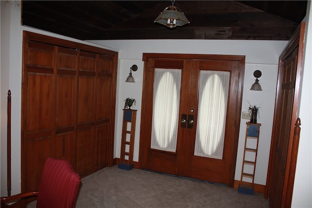 foyer entrance featuring french doors and carpet floors