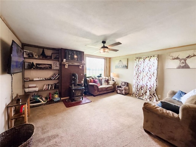 2281 US Rte 40, Casey, IL 62420 - carpeted living area featuring a wood stove and ceiling fan