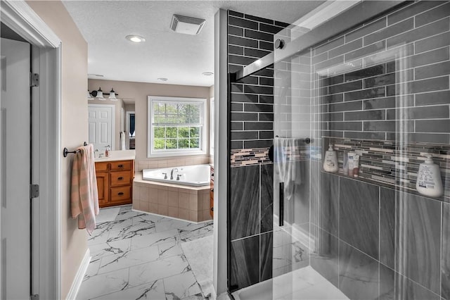 1435 Ashland Ave, Mt Zion, IL 62549 - full bath featuring marble look tile flooring, vanity, a bath, a stall shower, and recessed lighting