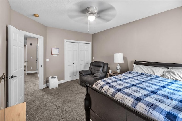 1435 Ashland Ave, Mt Zion, IL 62549 - bedroom with dark colored carpet, baseboards, a closet, and a ceiling fan