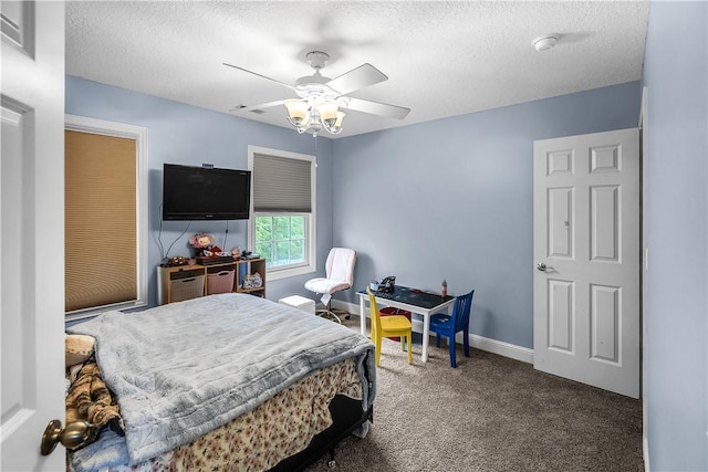 1435 Ashland Ave, Mt Zion, IL 62549 - carpeted bedroom featuring a textured ceiling, ceiling fan, and baseboards