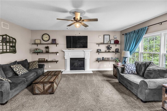 1435 Ashland Ave, Mt Zion, IL 62549 - living area featuring ceiling fan, carpet floors, a glass covered fireplace, and baseboards