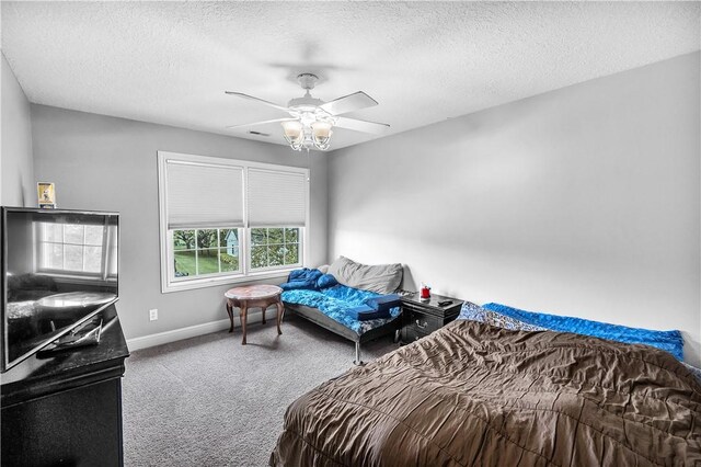 1435 Ashland Ave, Mt Zion, IL 62549 - carpeted bedroom with a textured ceiling, baseboards, and ceiling fan