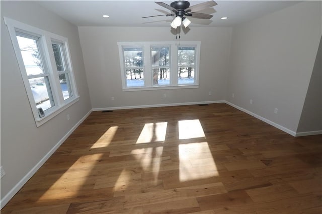 unfurnished dining area featuring ceiling fan and dark hardwood / wood-style flooring