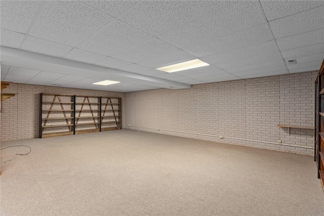 2104 Sycamore St, Effingham, IL 62401 - finished basement featuring brick wall, a paneled ceiling, and carpet