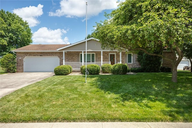 2104 Sycamore St, Effingham, IL 62401 - single story home featuring covered porch, an attached garage, brick siding, driveway, and a front yard