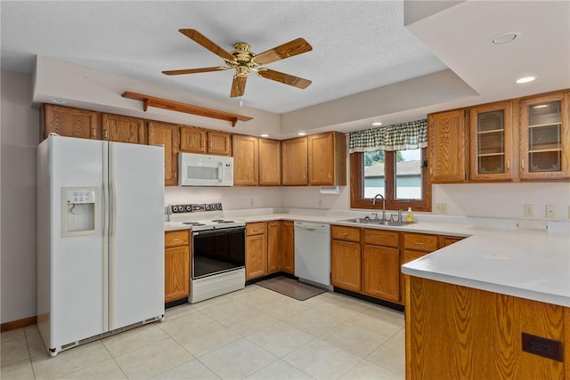2104 Sycamore St, Effingham, IL 62401 - kitchen with white appliances, brown cabinetry, light countertops, ceiling fan, and recessed lighting