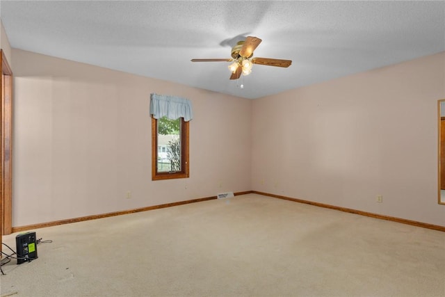 2104 Sycamore St, Effingham, IL 62401 - spare room with carpet flooring and a ceiling fan