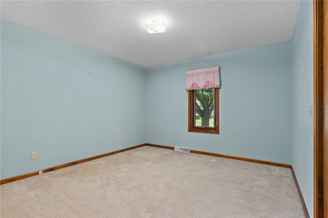 2104 Sycamore St, Effingham, IL 62401 - unfurnished room with carpet and a textured ceiling