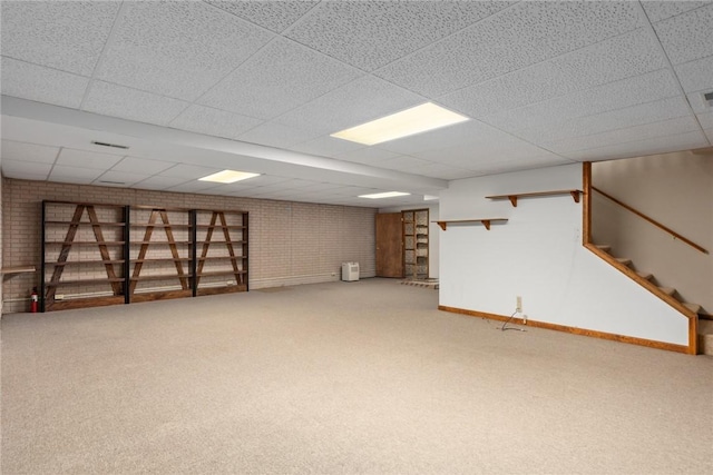 2104 Sycamore St, Effingham, IL 62401 - finished basement featuring a drop ceiling, carpet, stairs, and brick wall