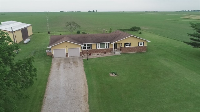 birds eye view of property with a rural view