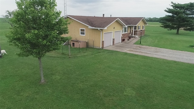 exterior space with a garage and a front yard