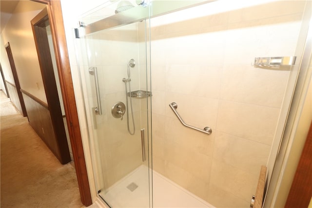 bathroom featuring an enclosed shower