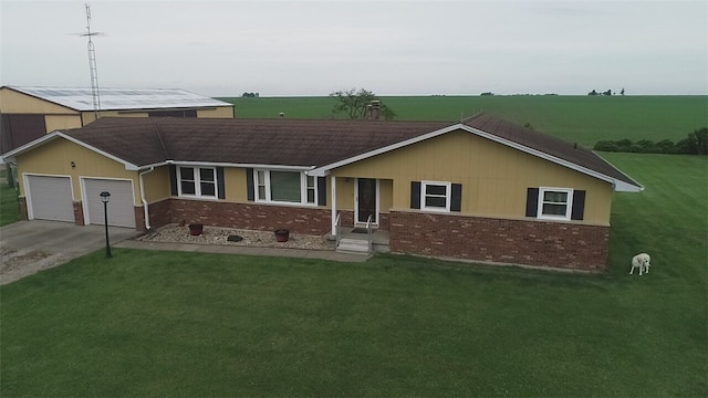 single story home with a garage and a front yard